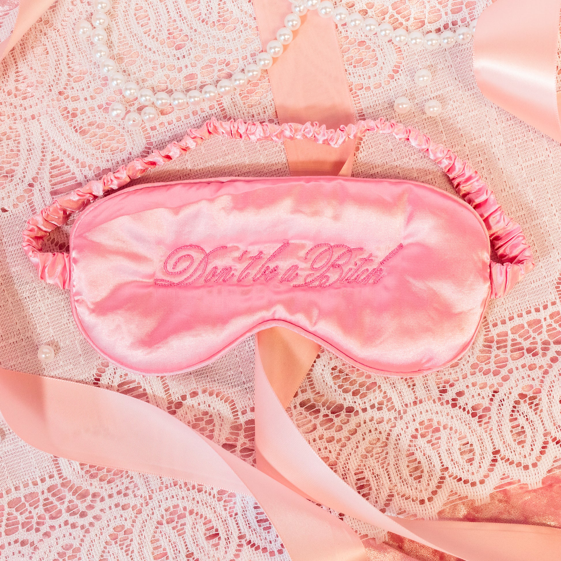 pink embroidered silk mask