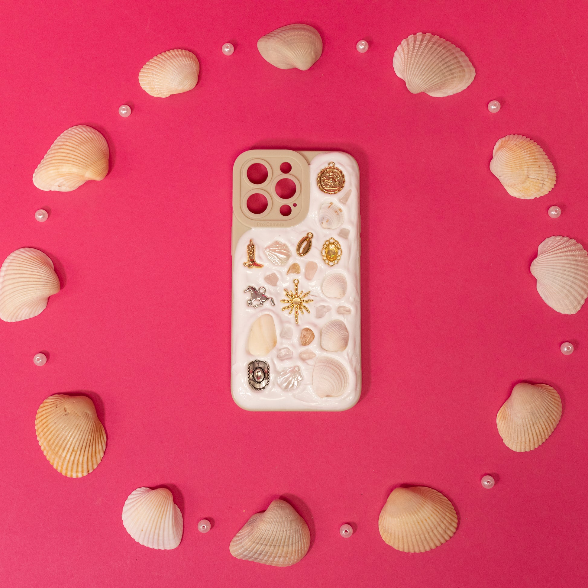 white phone case with seashells