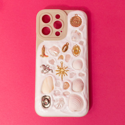 white case with gold and silver charms