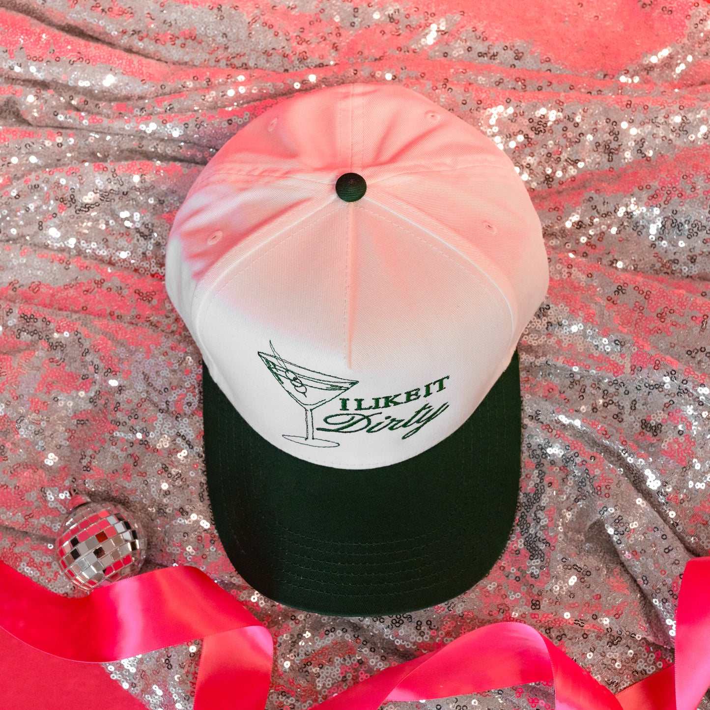 green and white trucker hat