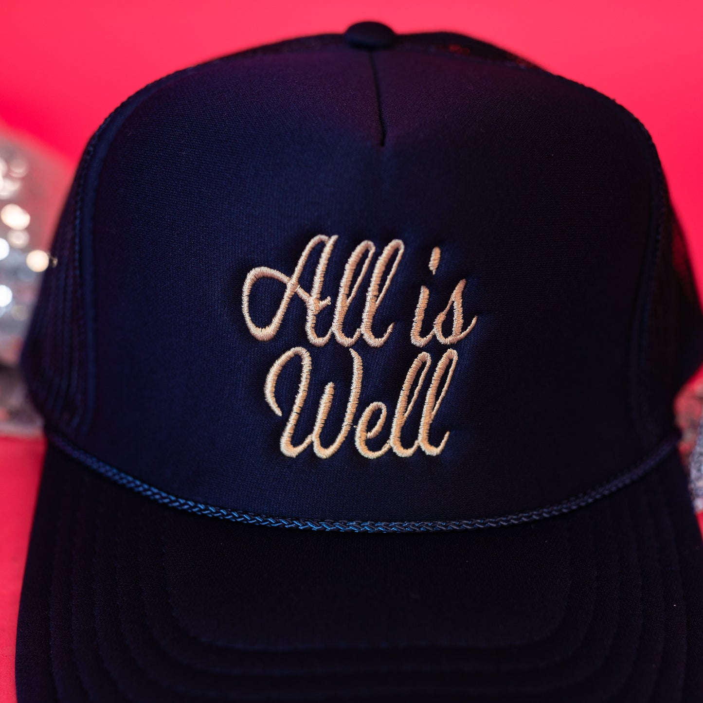 all is well embroidered trucker hat