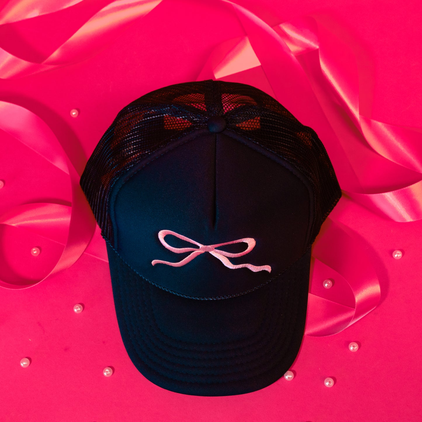 pink and blue trucker hat