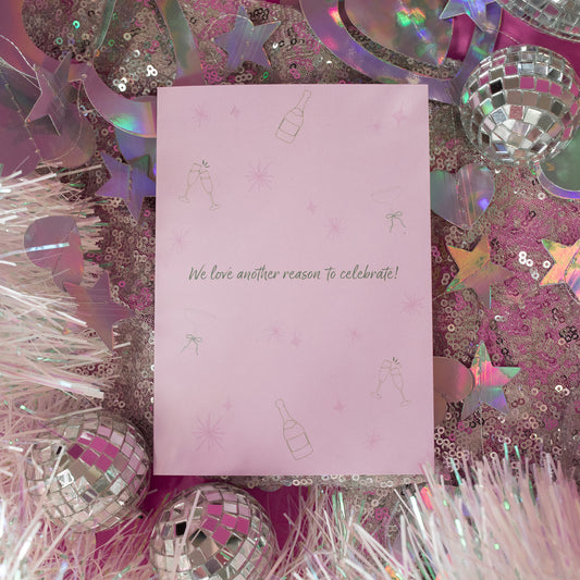 light pink card with green words