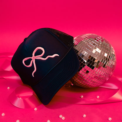 pink bow on navy hat