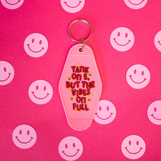 pink keychain with red words