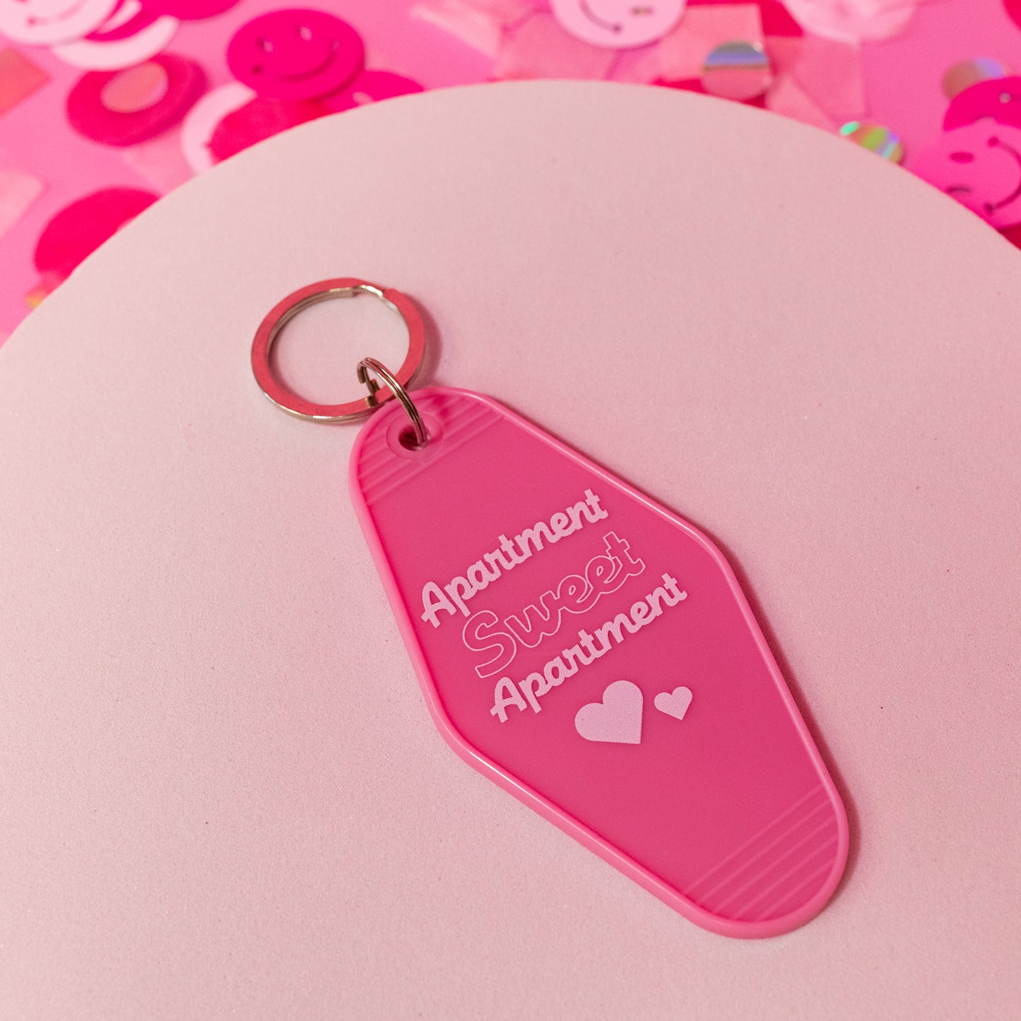 pink and white apartment keychain