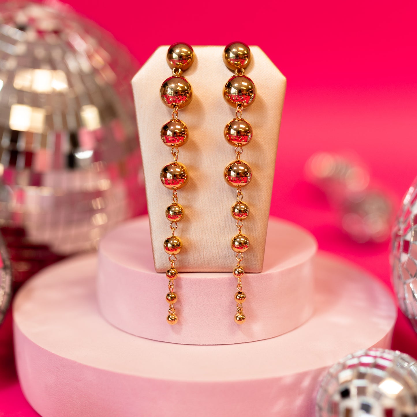 gold spheres dangle earrings