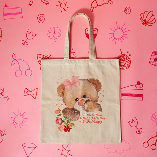 beige tote with brown teddy bear and pink bow