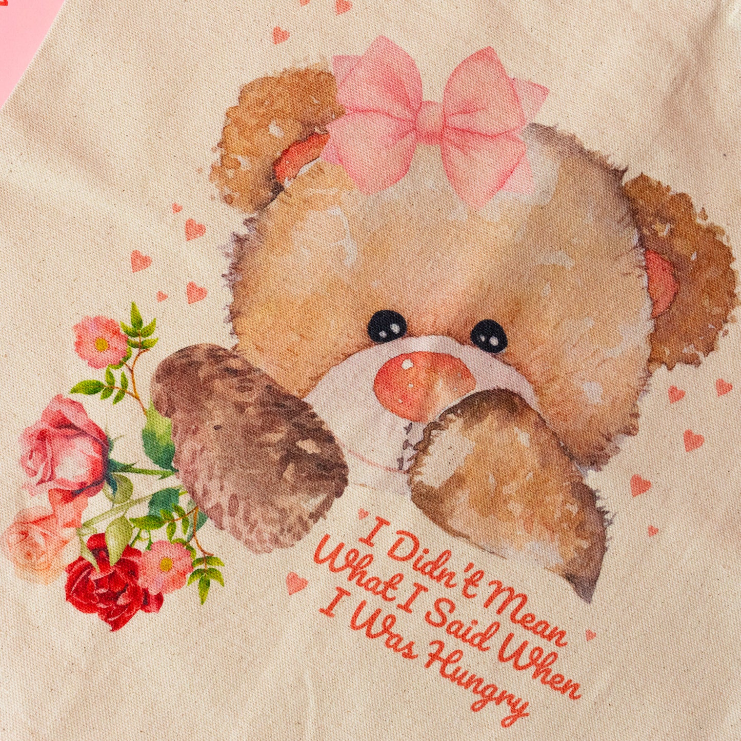 brown teddy bear red and pink flowers