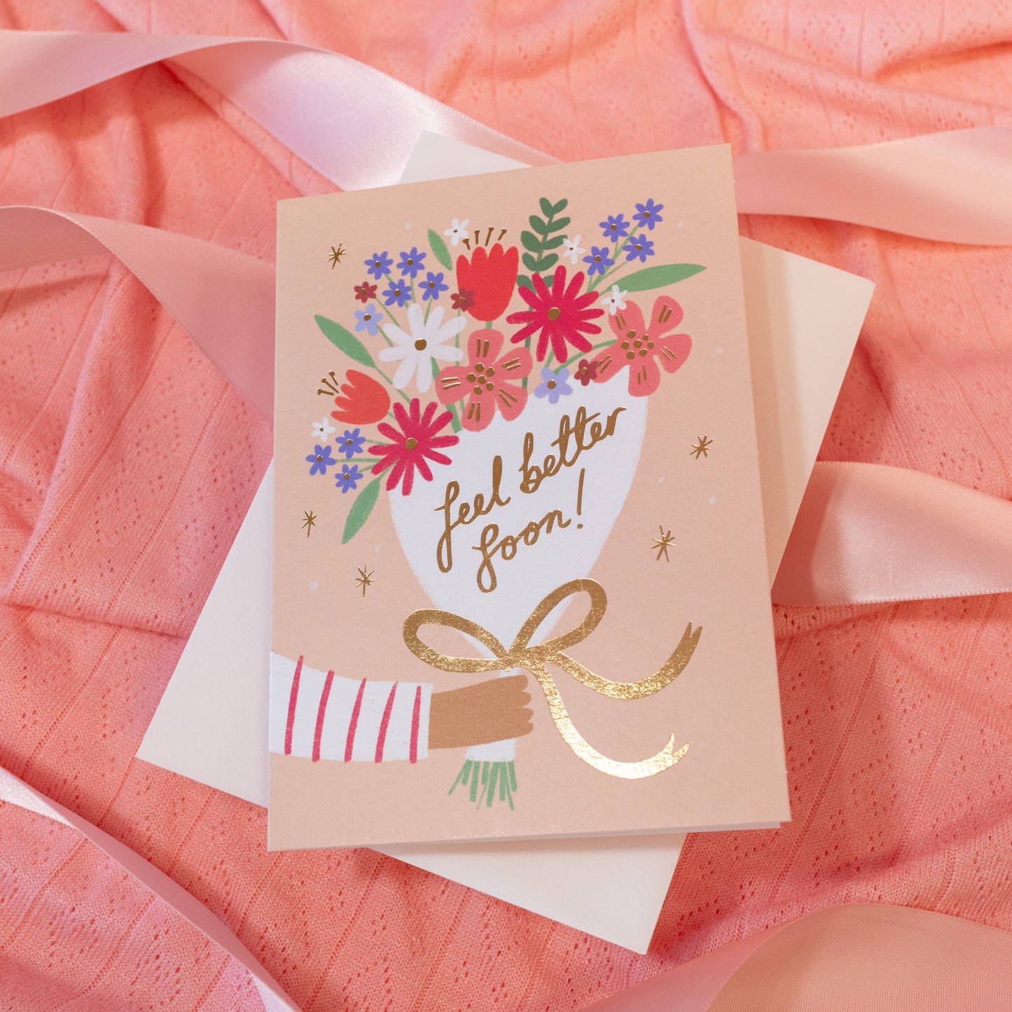 peach card with colorful flowers