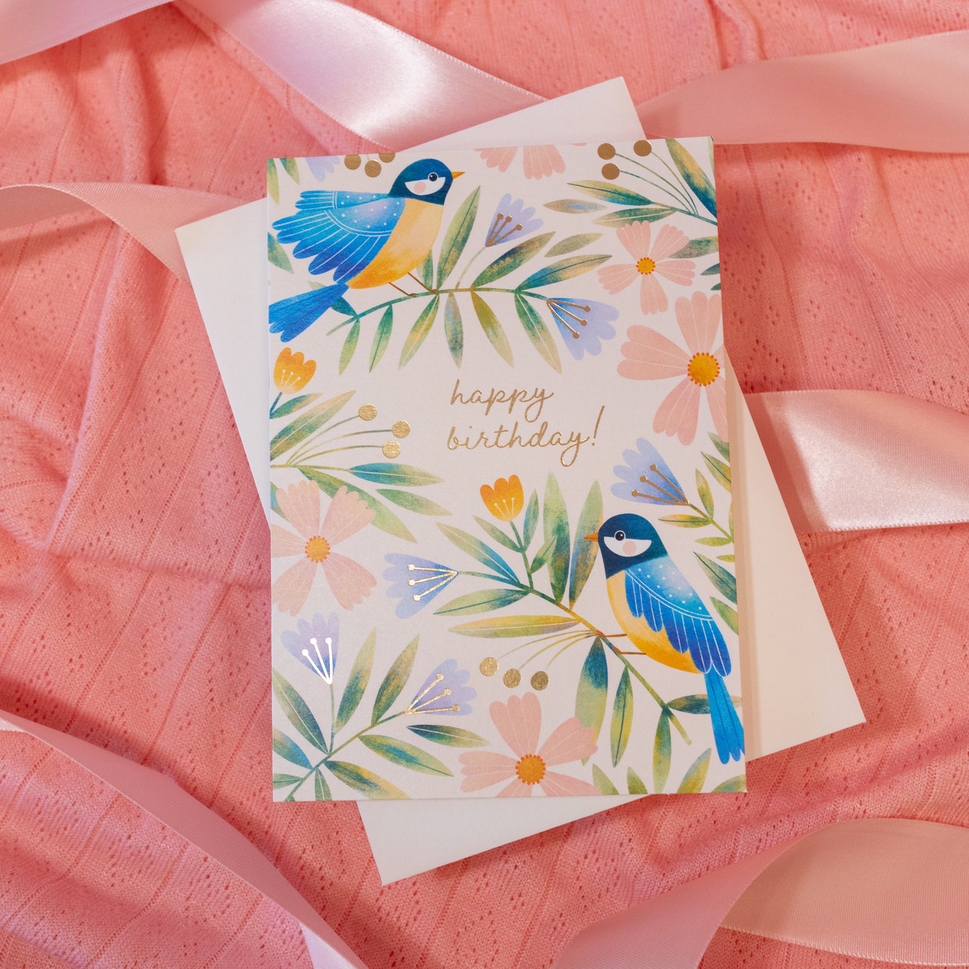 white card with greenery and birds