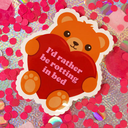brown teddy bear holding red heart sticker